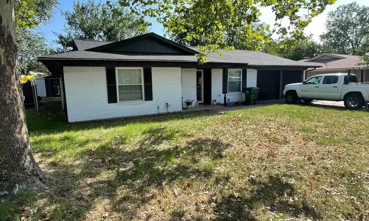 Professional roofing crew working on a residential roof in Woods Creek